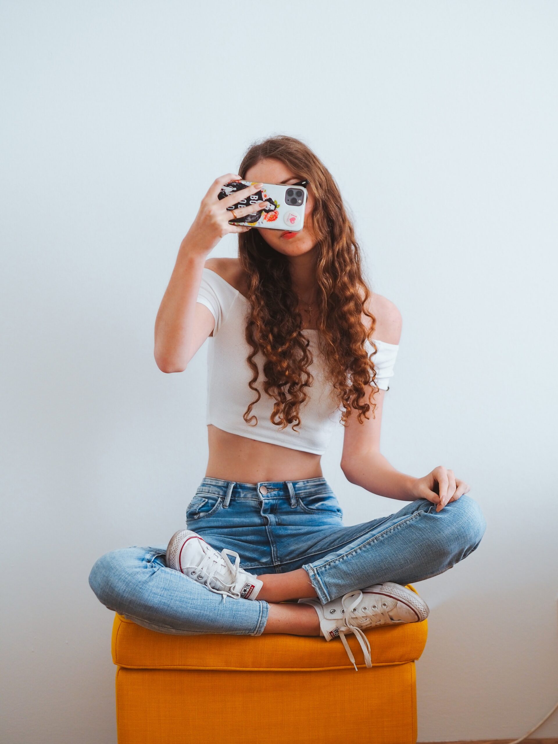 Woman taking mirror selfie