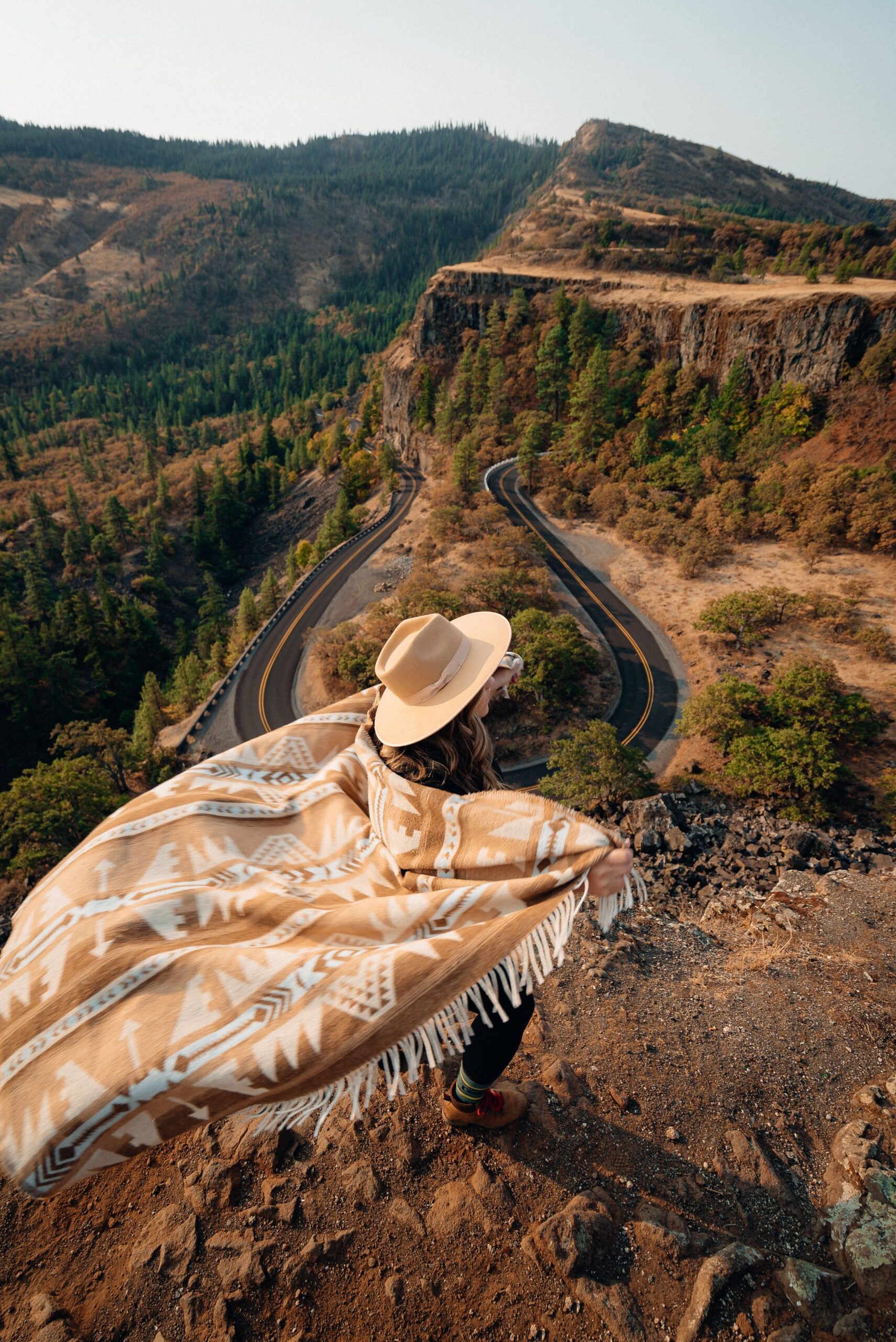 A woman in a cowboy hat in the west